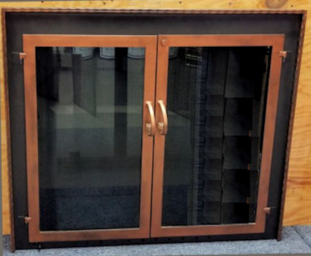 Buzzards Bay (Molding on surround)  Black frame with antique copper molding,  twin/cabinet style doors standard forged handles. Comes with slide mesh spark screen.